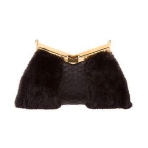 J Mendel mink and python Minuit clutch. Never used. ❤️